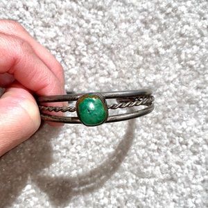 Metal cuff bracelet with green stone